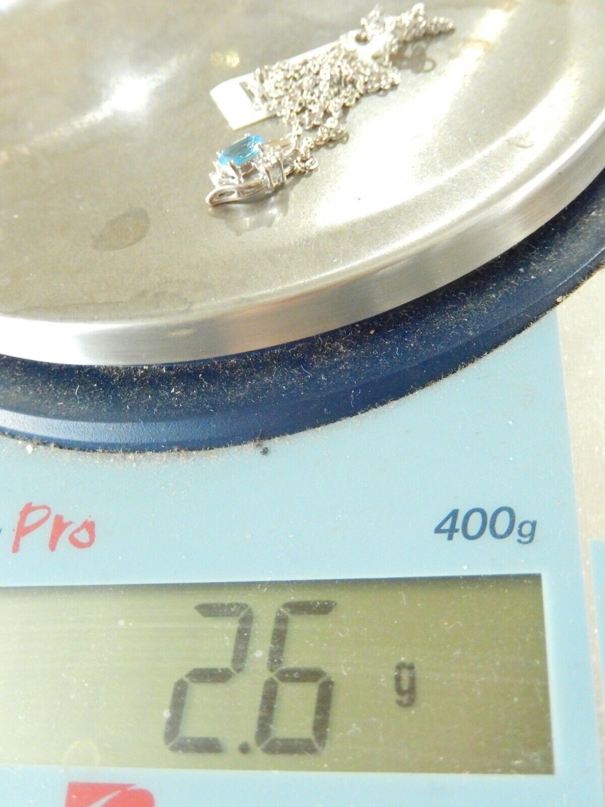 10k White Gold Oval Blue Topaz And Diamond Pendant with 18" Chain