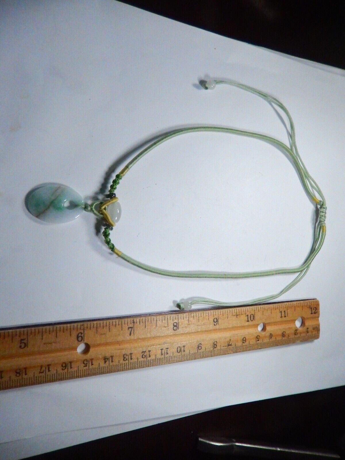 Jade Pendant on corded adjustable necklace. Cord adjustable 15 To 24 inches.