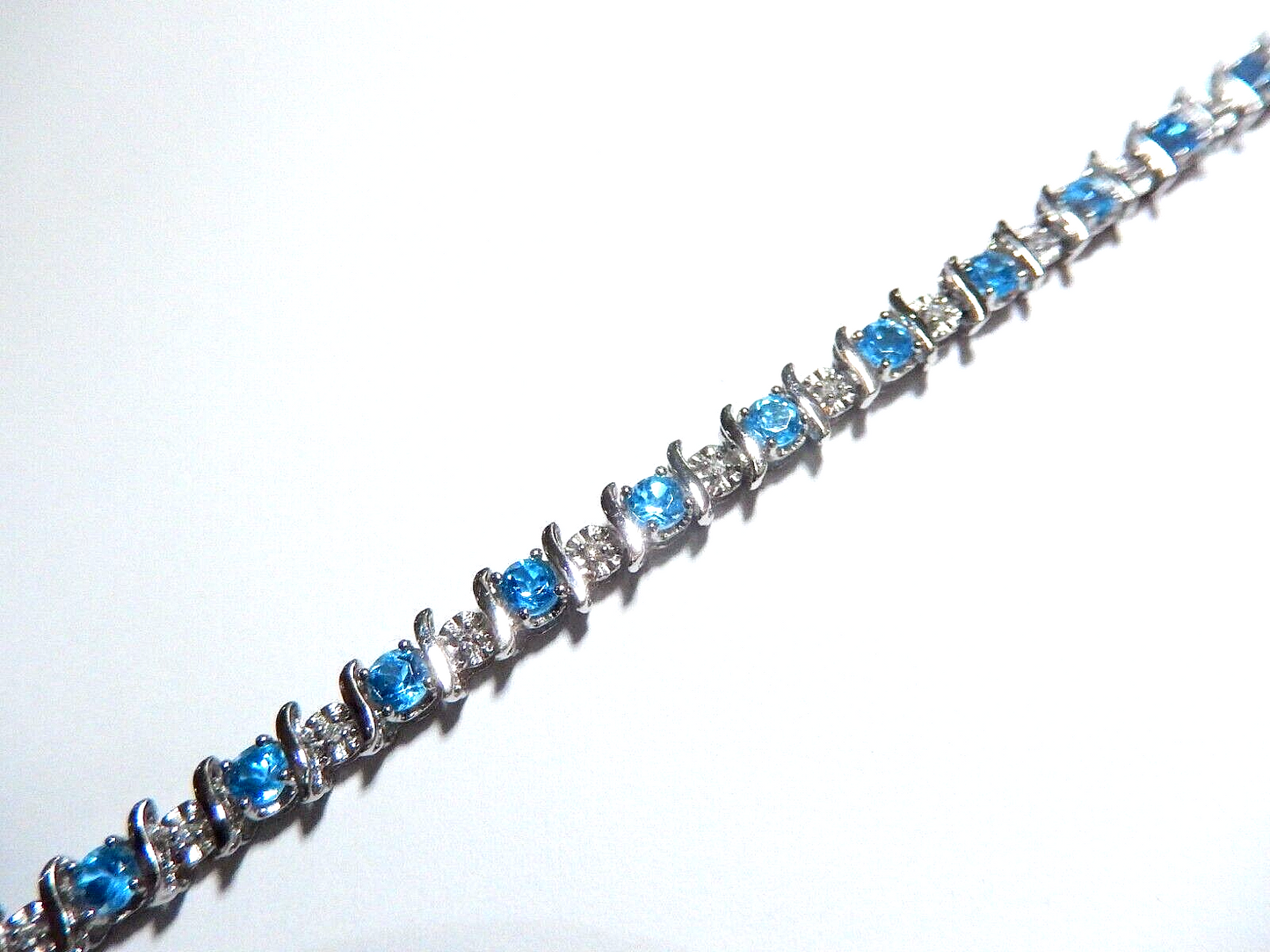 Stamped 14K White Gold 24 Blue Topaz and 24 Diamond Bracelet 7.5" approx. 7.7gms