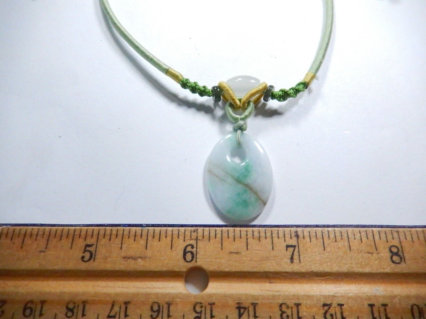 Jade Pendant on corded adjustable necklace. Cord adjustable 15 To 24 inches.