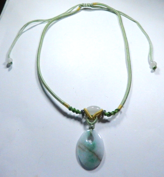 Jade Pendant on corded adjustable necklace. Cord adjustable 15 To 24 inches.