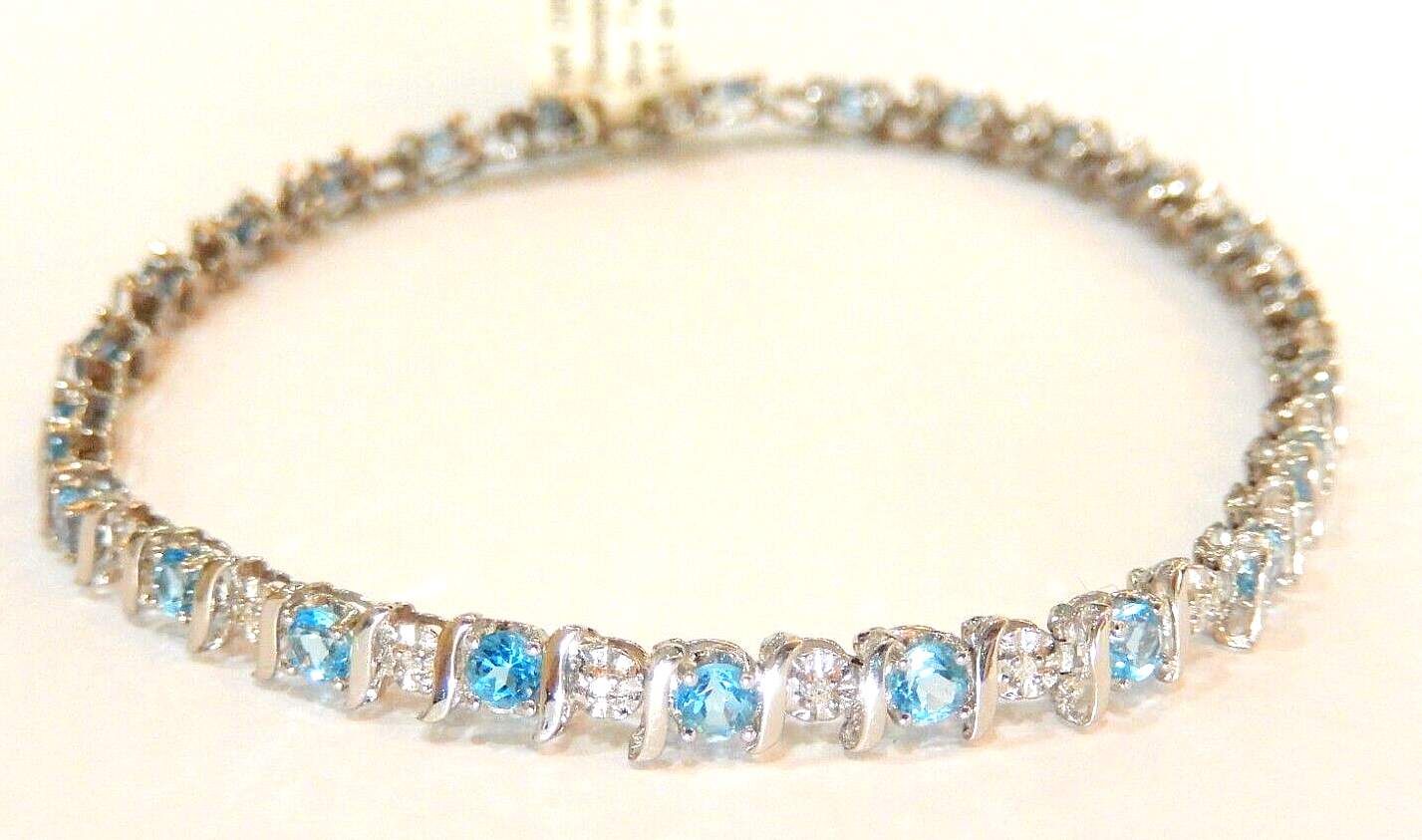 Stamped 14K White Gold 24 Blue Topaz and 24 Diamond Bracelet 7.5" approx. 7.7gms