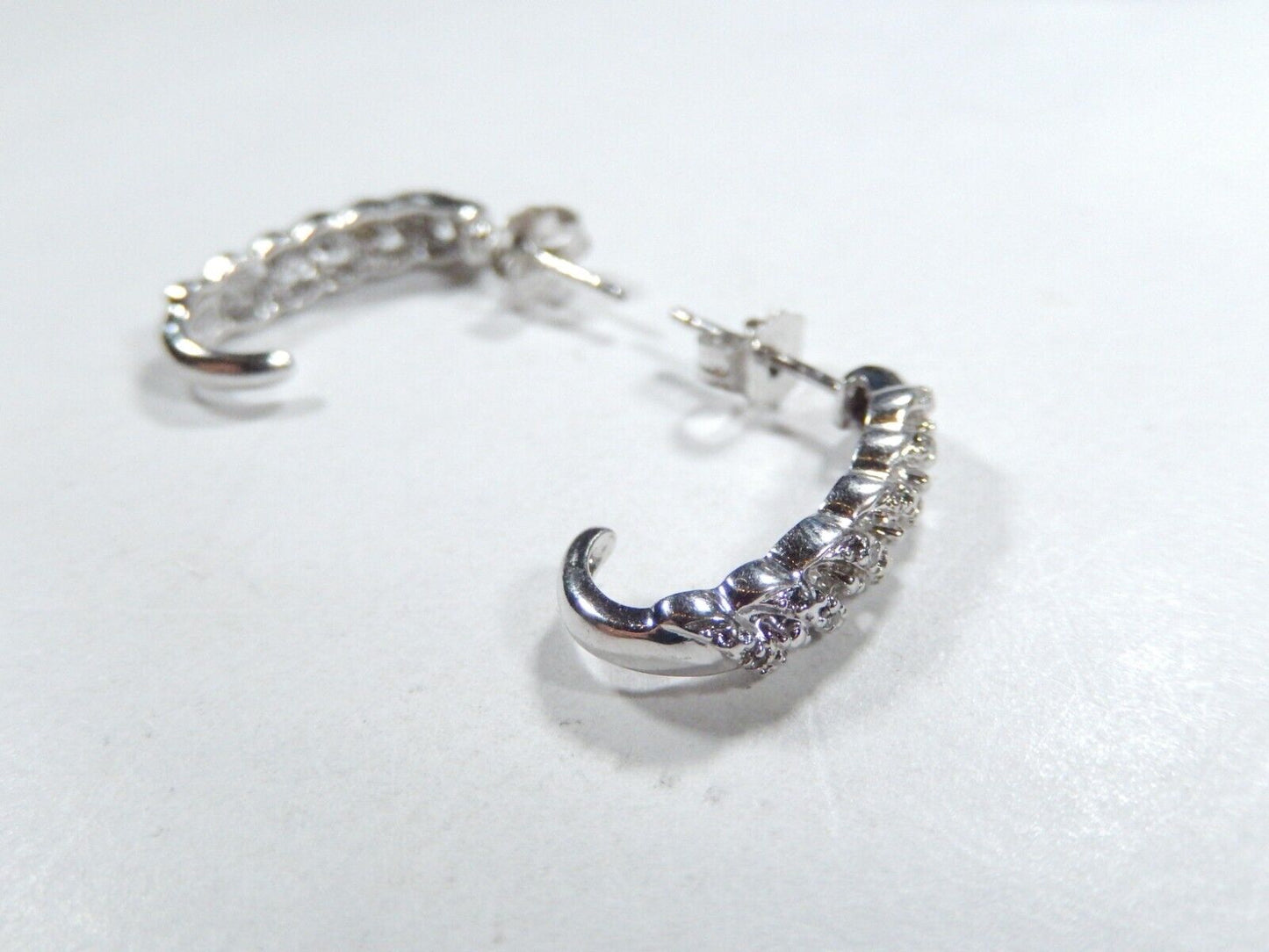 Sterling Silver .25ctw Genuine Natural Diamond J-Hoop Earrings.