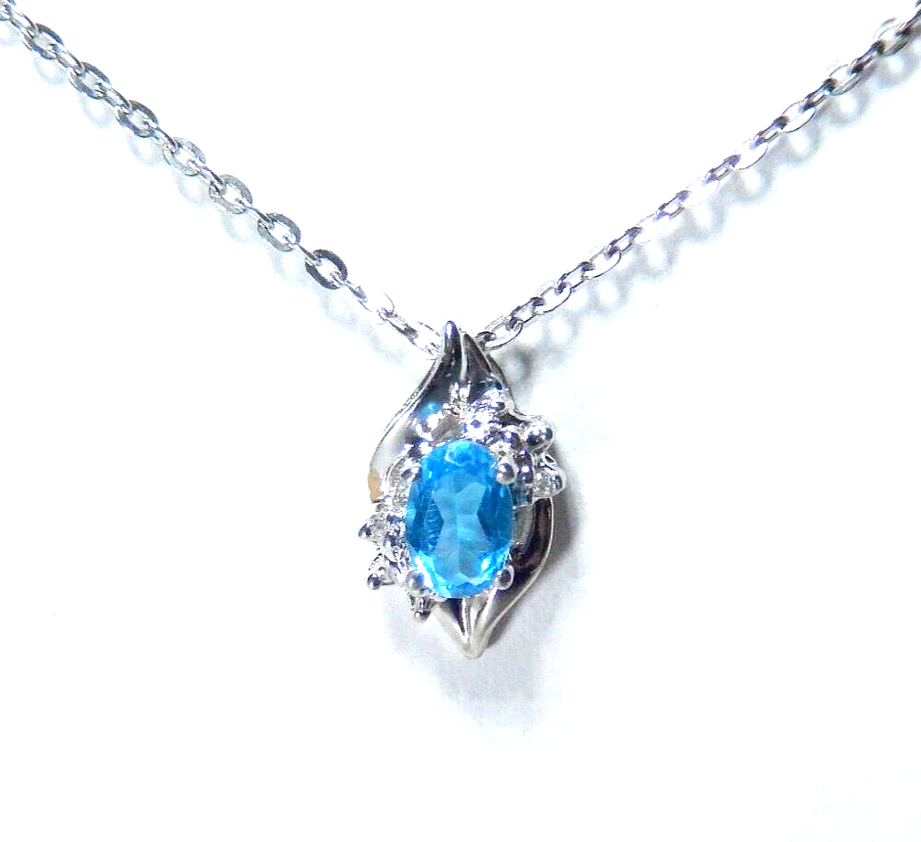 10k White Gold Oval Blue Topaz And Diamond Pendant with 18" Chain