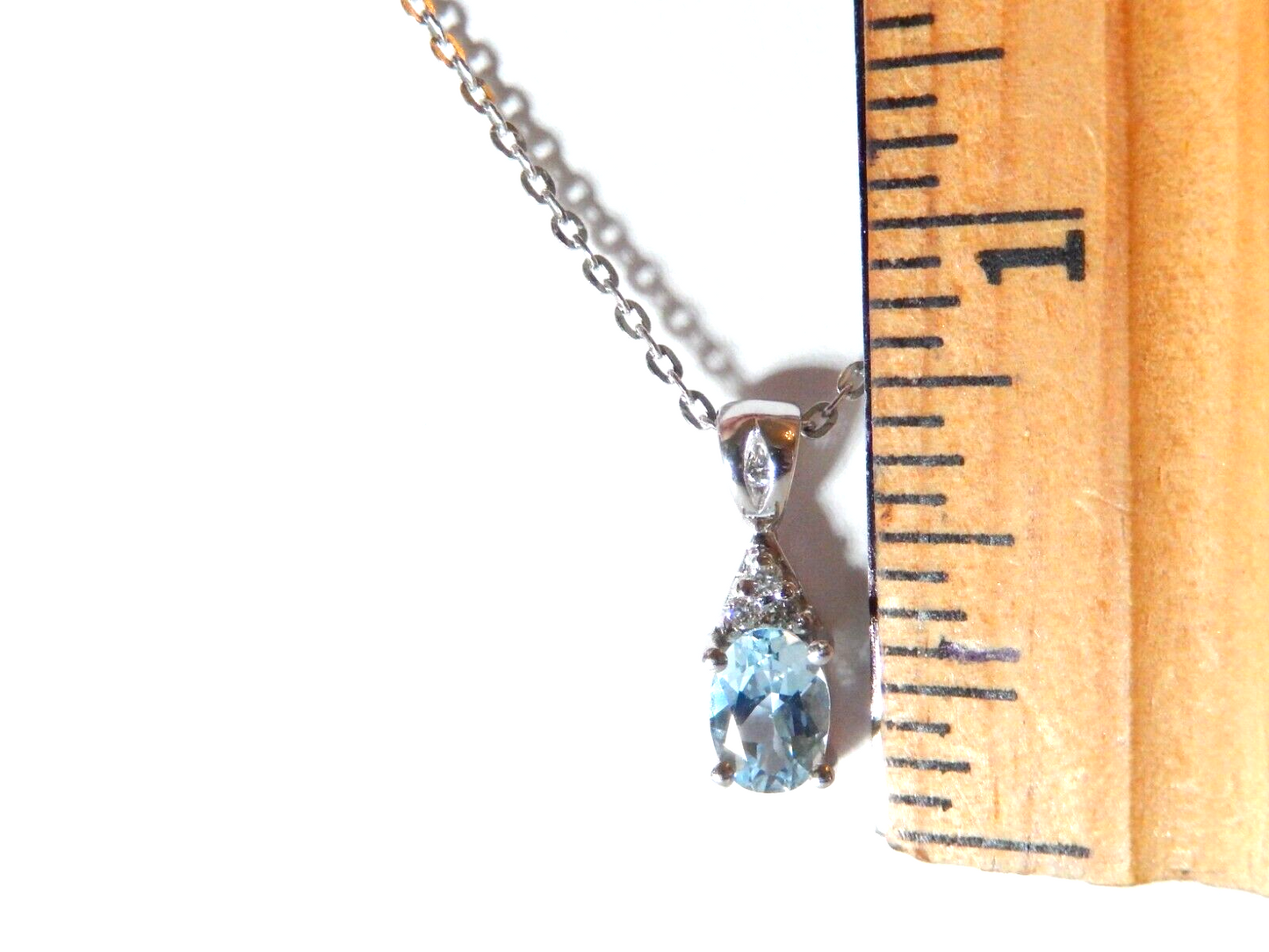 10k White Gold Oval Blue Topaz And Diamond Pendant with 18" Chain