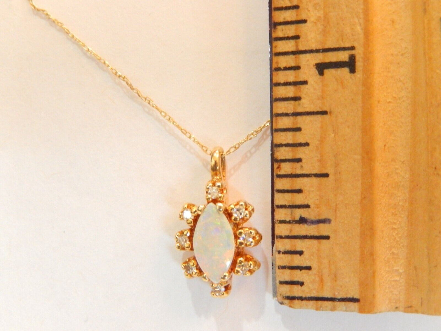10k Yellow Gold Marquise Opal And 8 Diamond Pendant with 18" 10K Chain