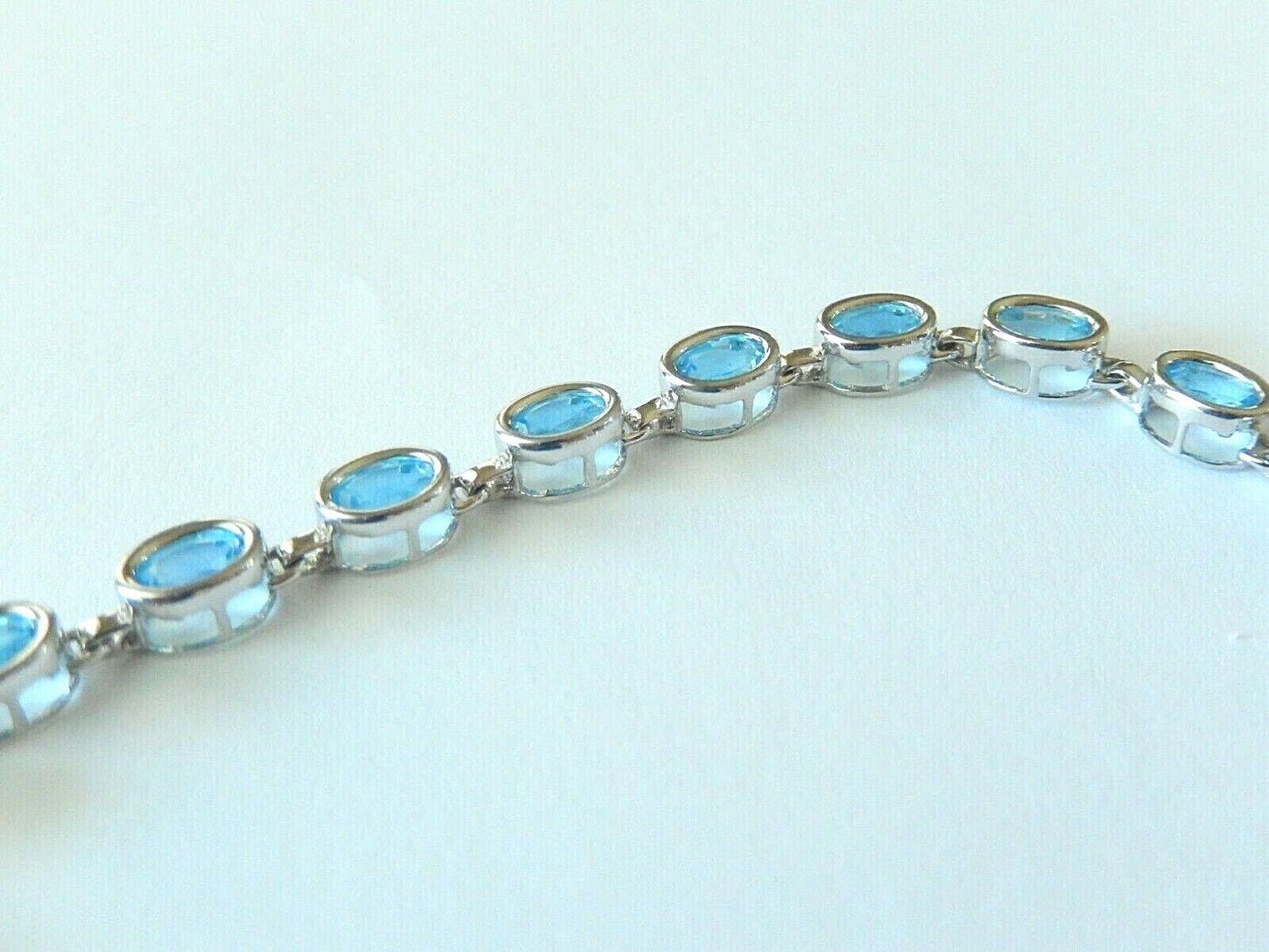 *NWT* 14K WHITE GOLD 8.50 CT OVAL BLUE TOPAZ  TENNIS BRACELET  7.25" - 8.2gms