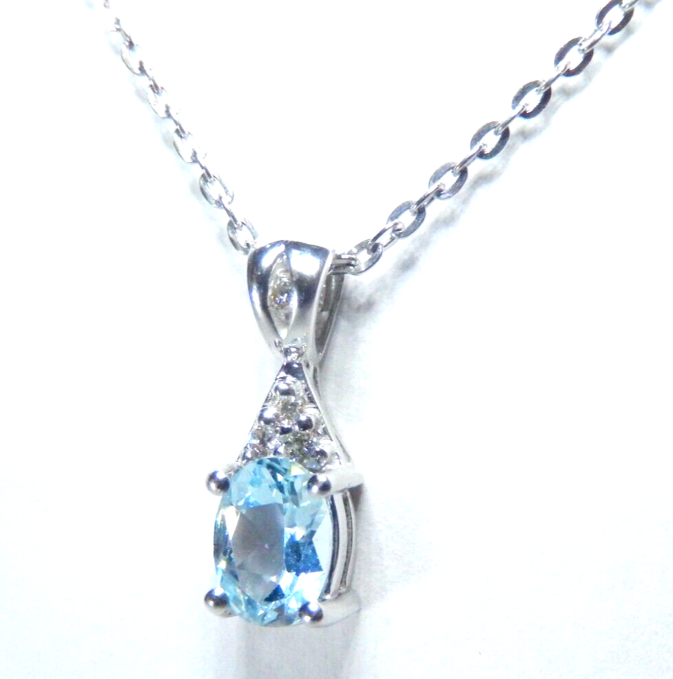 10k White Gold Oval Blue Topaz And Diamond Pendant with 18" Chain