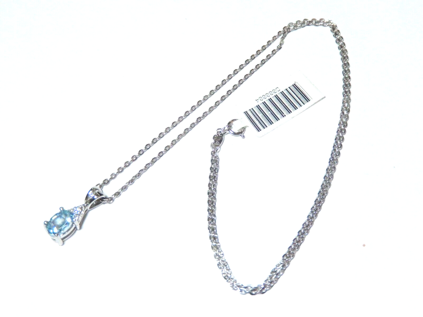 10k White Gold Oval Blue Topaz And Diamond Pendant with 18" Chain