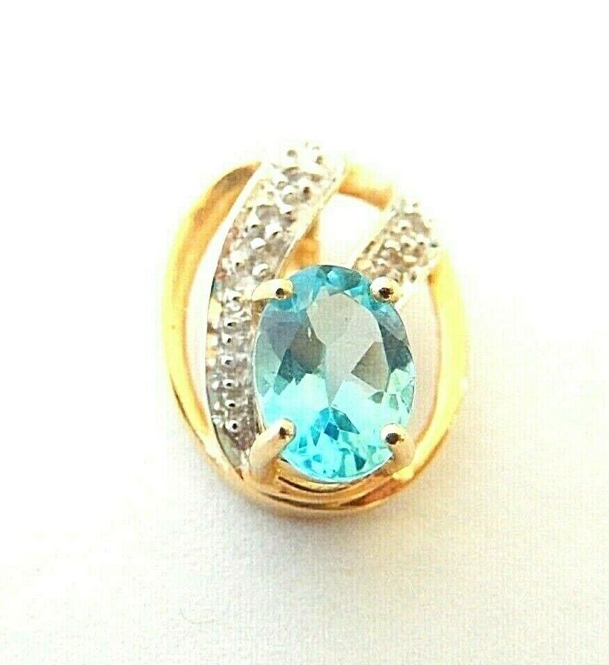 *VINTAGE* 14K Yellow Gold .75 CT Oval Blue Topaz & Diamond Accented Pendant