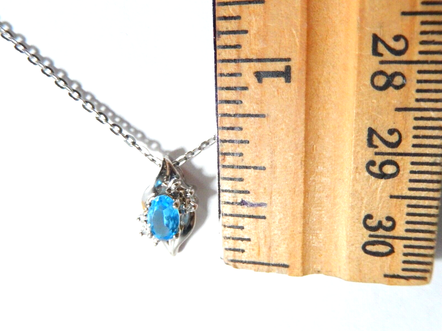 10k White Gold Oval Blue Topaz And Diamond Pendant with 18" Chain