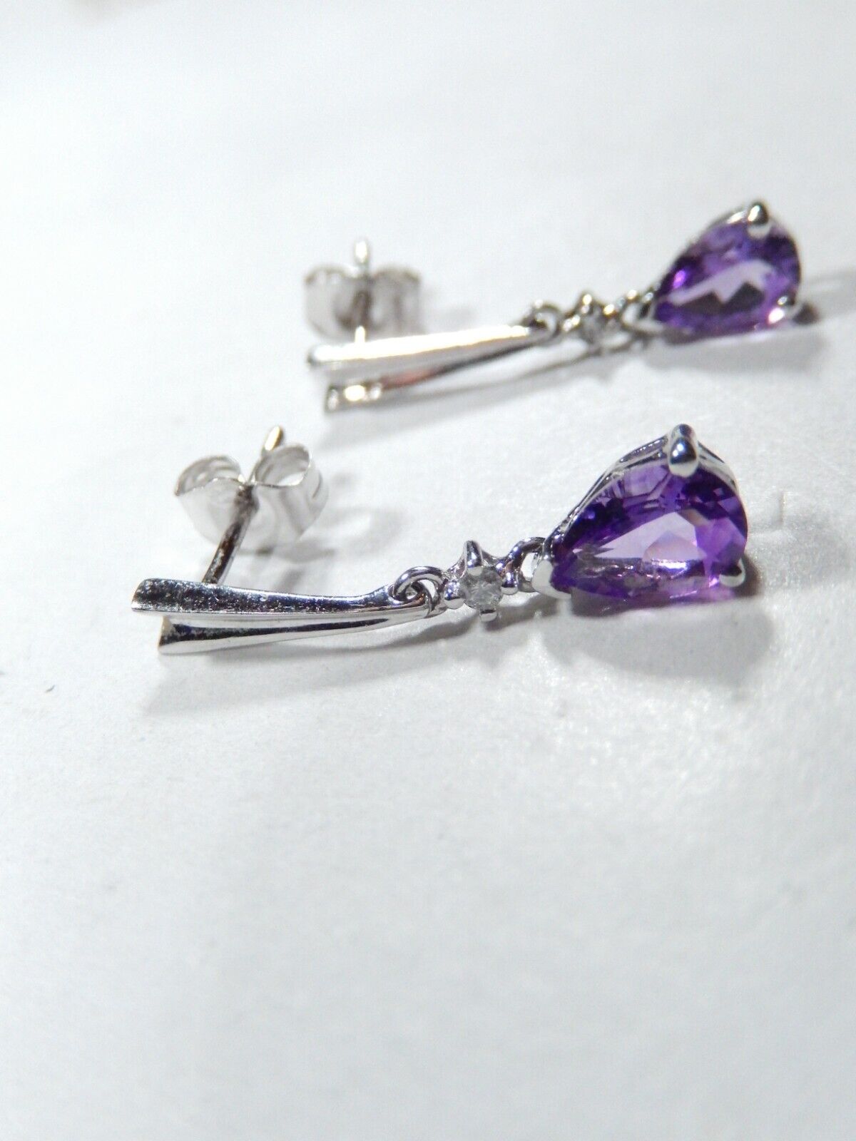 10k White Gold .75CT TW Diamond and Pear Shape Amethyst Dangle Earrings