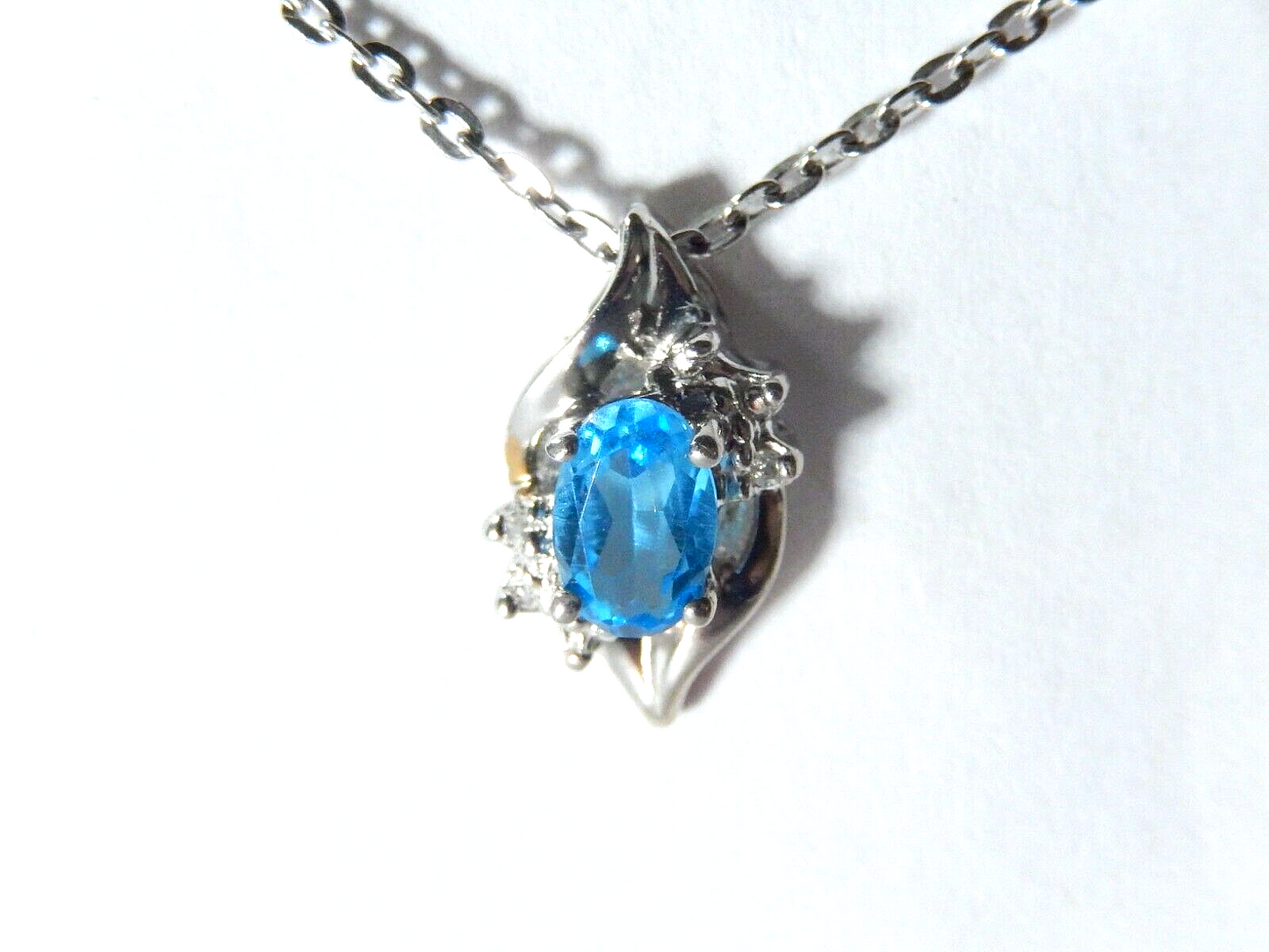 10k White Gold Oval Blue Topaz And Diamond Pendant with 18" Chain