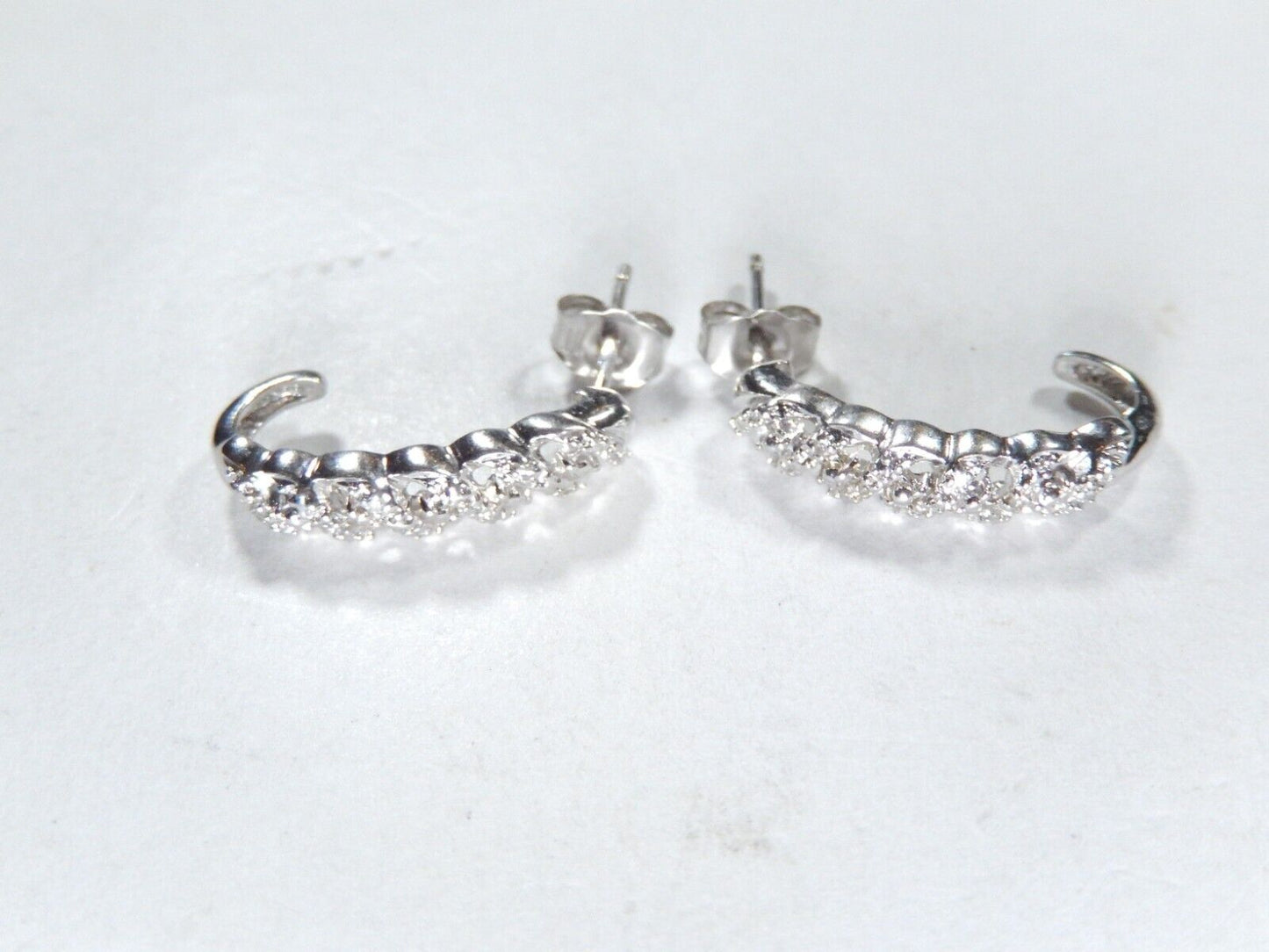 Sterling Silver .25ctw Genuine Natural Diamond J-Hoop Earrings.