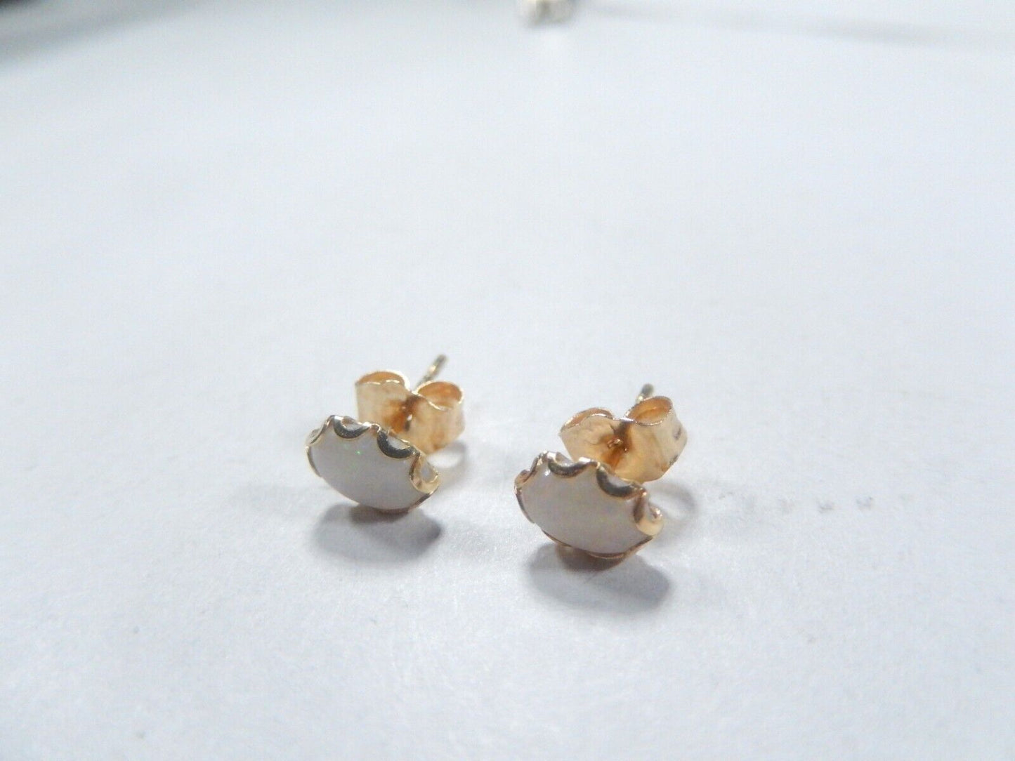 14k Yellow Gold White Color Play Opal Oval Stud Earrings 6.78mm x 4.90mm