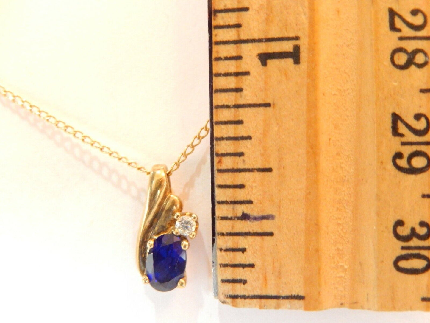 10k Yellow Gold Oval Sapphire And Diamond Pendant with 18" Chain