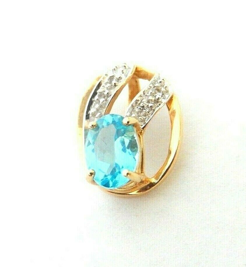 *VINTAGE* 14K Yellow Gold .75 CT Oval Blue Topaz & Diamond Accented Pendant