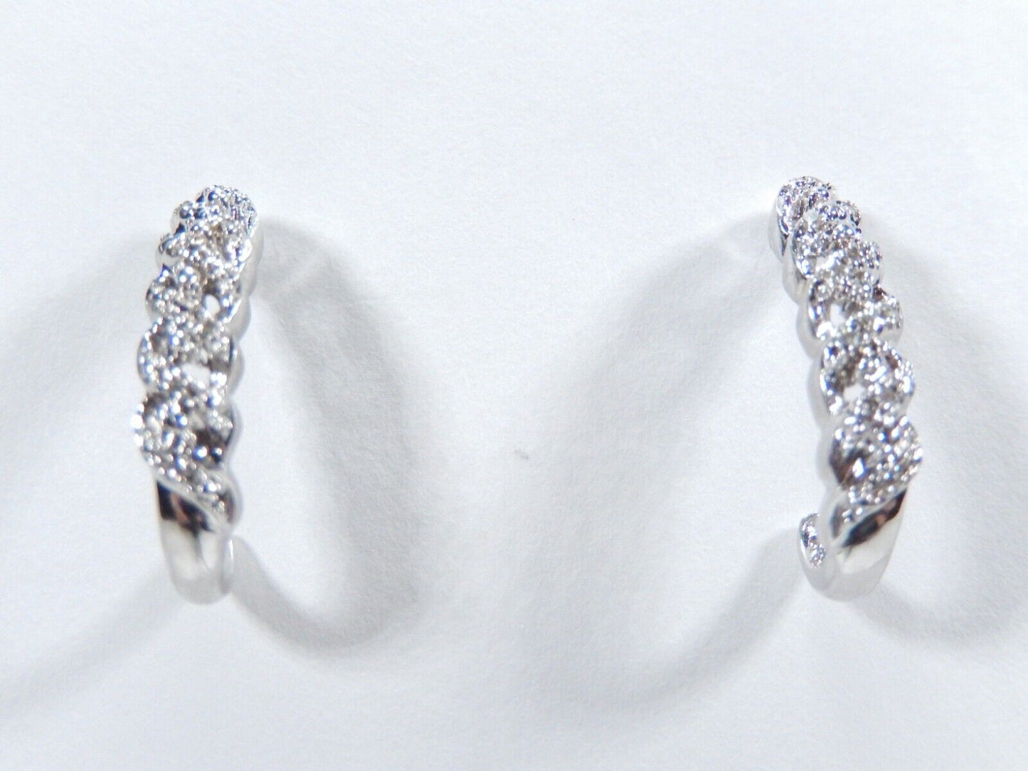 Sterling Silver .25ctw Genuine Natural Diamond J-Hoop Earrings.