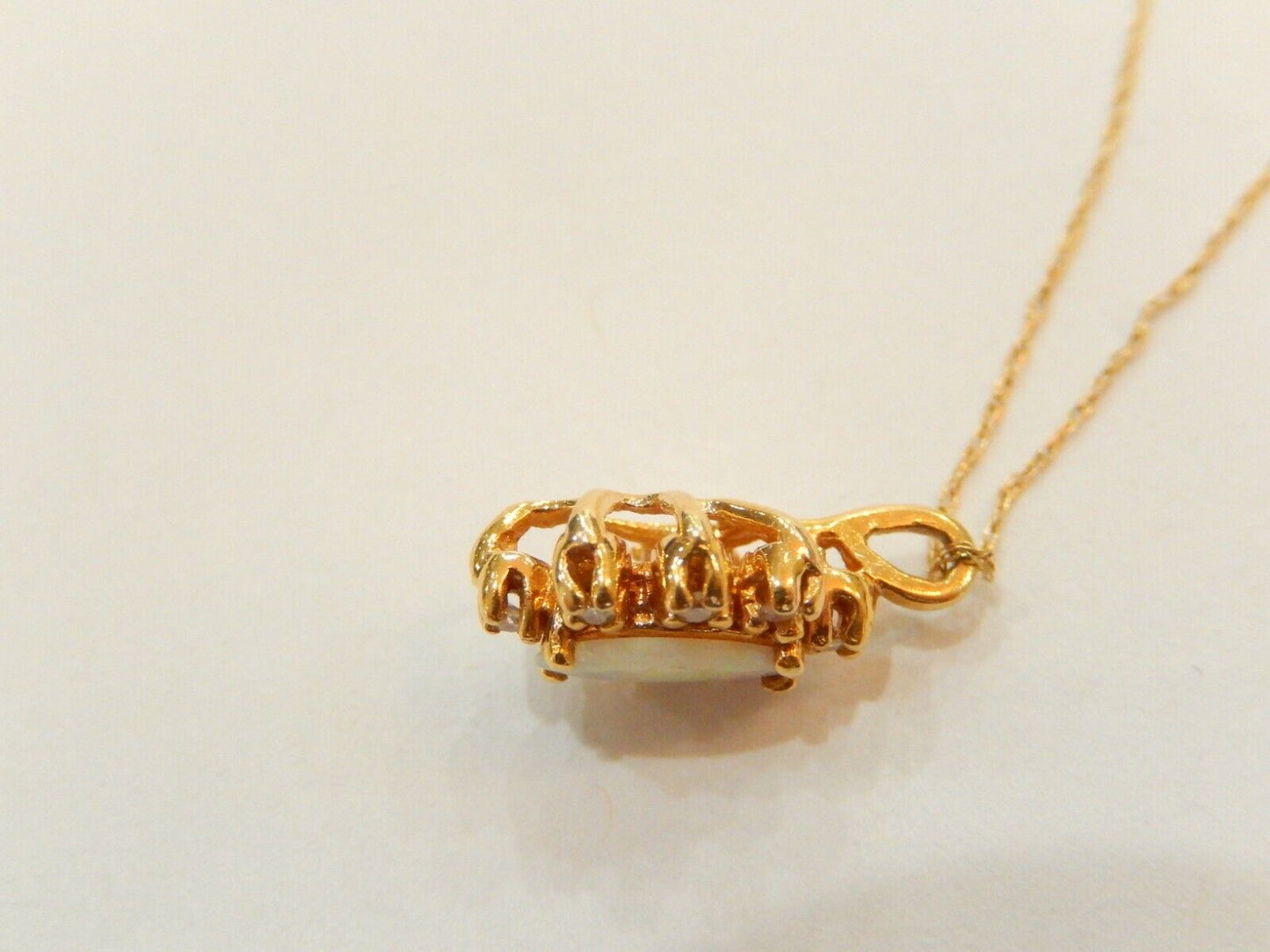 10k Yellow Gold Marquise Opal And 8 Diamond Pendant with 18" 10K Chain
