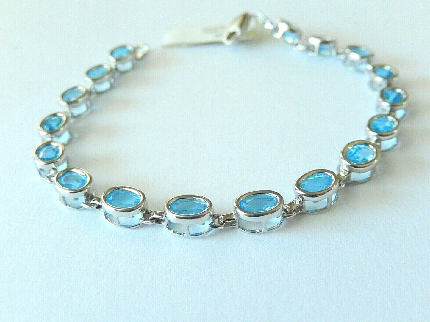 *NWT* 14K WHITE GOLD 8.50 CT OVAL BLUE TOPAZ  TENNIS BRACELET  7.25" - 8.2gms