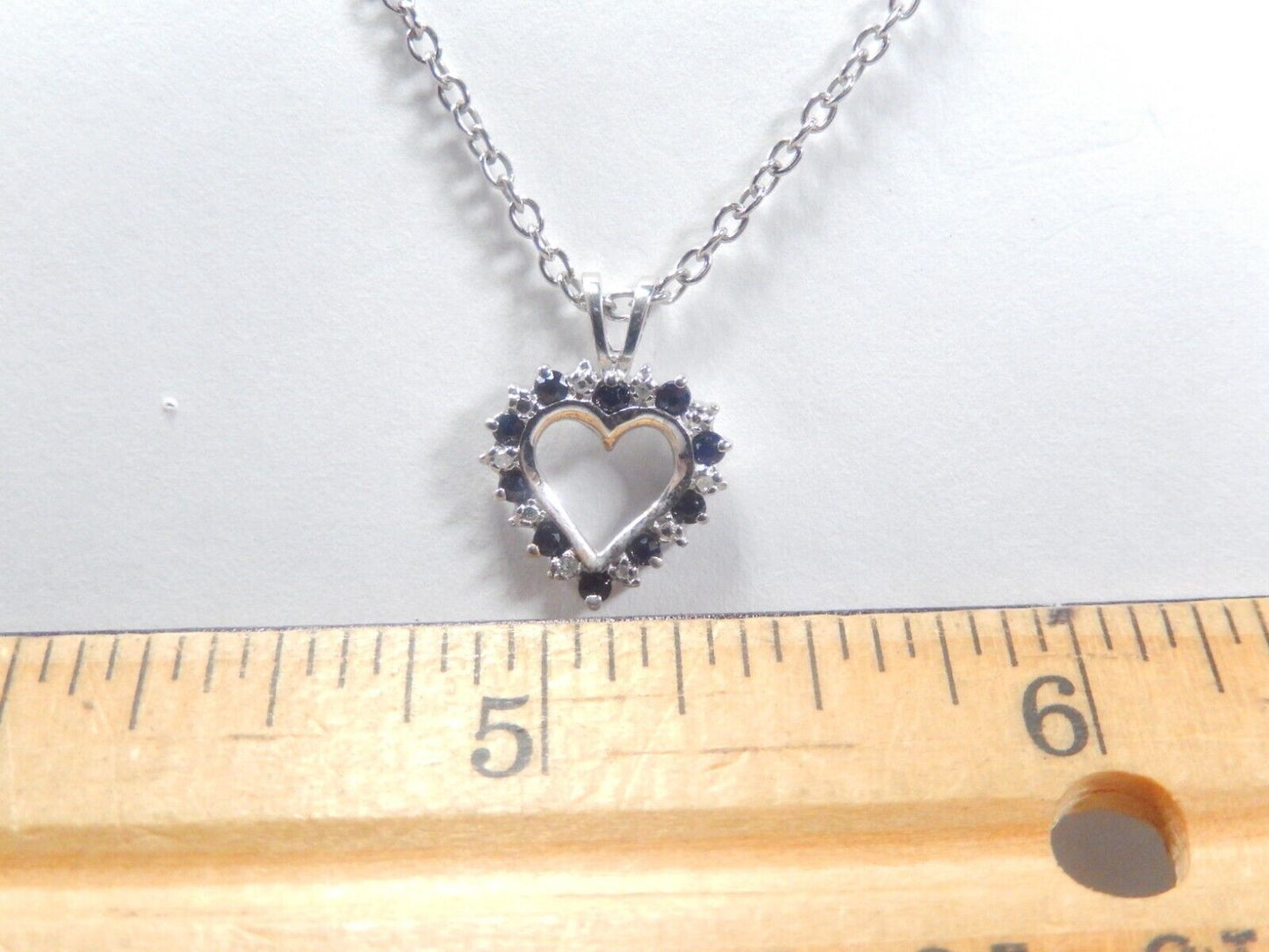 10k White Gold Round Sapphire And Diamond Heart Pendant with 18" Chain