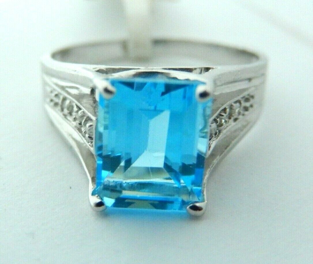 10K White Gold Emerald Cut  London Blue Topaz with Diamond Accent Sz 7.5